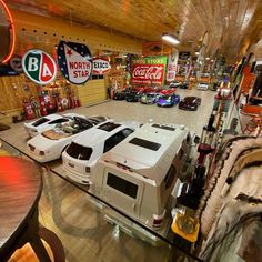 a room filled with lots of different types of cars