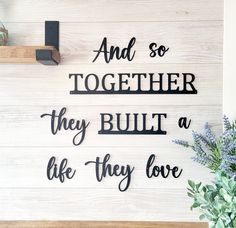 a wooden sign that says and so together they built a life they love