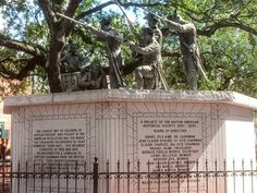 there is a monument with statues on it