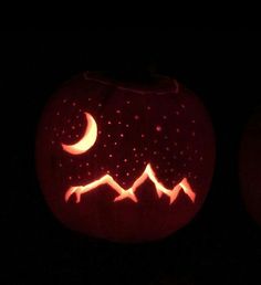 a carved pumpkin with the moon and stars on it