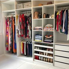 the closet is full of clothes and shoes