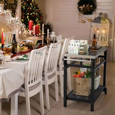 a dining room table set for christmas dinner