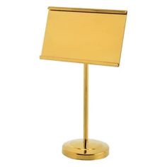 a gold metal stand with a sign on it's side and a white background