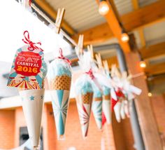 some ice cream cones are hanging from the ceiling