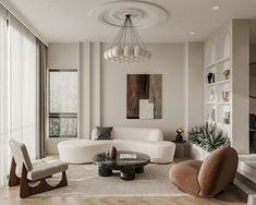 a living room filled with white furniture and lots of windows