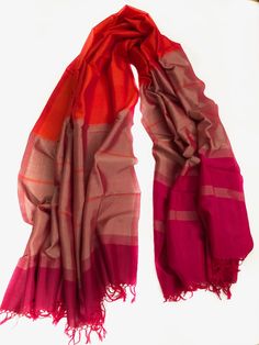 HANDMADE RAW SILK SCARF/ SHAWL  EACH PRODUCT IS UNIQUE AND ONE OF A KIND.  These scarves are made in Sri Lanka and are a product of hand looming, which is a traditional art carried through generations in Sri Lanka.  Yes, these beautiful products are made completely by hand and processed naturally. Traditional Red Pashmina Shawl For Festive Occasions, Red Shawl Dupatta For Diwali, Red Festive Pashmina Shawl With Traditional Patterns, Traditional Red Scarves With Traditional Drape, Traditional Red Scarves For Festivals, Festive Red Pashmina Shawl With Traditional Patterns, Red Bollywood Style Festive Pashmina Shawl, Bollywood Style Red Shawl With Pallu, Red Silk Bollywood Shawl