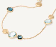 This necklace features a selection of topaz and London blue topaz stones on an exceptionally fine chain, interspersed with 18K yellow gold disks hand-engraved using the ancient Florentine technique. Marco Bicego, Topaz Necklace, Blue Topaz Stone, Gold Disc, Topaz Stone, Shiny Things, London Blue Topaz, London Blue, Hand Engraving