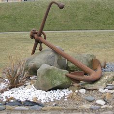 an anchor is sitting on top of some rocks