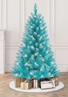 a blue christmas tree with presents under it