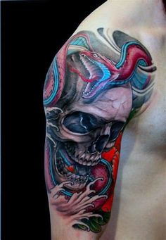 a man's half sleeve with a skull and dragon tattoo on his arm,