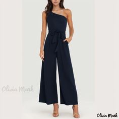 Olivia Mark - Stylish Off-Shoulder Jumpsuit with a Solid Color and Strappy Detail Chic Navy Sleeveless Jumpsuits And Rompers, Chic Navy Jumpsuit For Work, One-shoulder Jumpsuits And Rompers For Date Night In Summer, One Shoulder Jumpsuits And Rompers For Date Night, Chic Off-shoulder Blue Jumpsuit, Solid One-shoulder Jumpsuits And Rompers For Date Night, One Shoulder Solid Jumpsuit For Date Night, One Shoulder Summer Formal Jumpsuits And Rompers, Formal One-shoulder Jumpsuits And Rompers For Summer