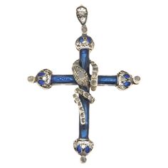 This exquisite pendant cross is a seamless blend of spiritual symbolism and luxurious craftsmanship, sure to captivate and enchant. Masterfully crafted from 14-karat yellow gold and 800 millesimi silver, this piece stands out with its exceptional design and quality materials, promising not only an aesthetic delight but also a durable and lasting addition to any jewelry collection. The body of the cross is adorned with meticulously applied fire enamel in a striking blue shade, providing a vibrant contrast against the warm glow of the yellow gold. This enamel not only enhances the visual appeal of the pendant but also adds a layer of protection to the metal beneath, ensuring that the beauty of the cross endures. Highlighting the cross’s elegant design are rose-cut diamonds, carefully set to Yellow Gold Pendants, Rose Cut Diamond, Gold Pendant Necklace, Rose Cut, Cross Pendant, Gold Pendant, Style Vintage, Elegant Design, Jewelry Necklace Pendant