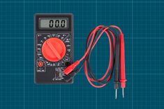 a digital multimeter with an orange cord connected to it