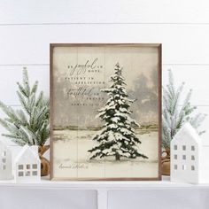 a christmas tree is sitting on top of a mantle with small white houses around it