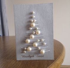 a christmas tree made out of pins on a card