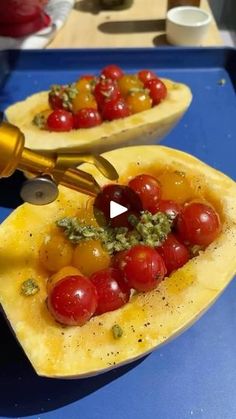 a person is cutting tomatoes into small boats