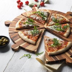 several slices of pizza on wooden cutting boards