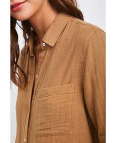 Lightweight, cotton gauze, long sleeve, toffee brown collared buttondown shirt featuring classic fit, patch pocket at chest, and natural shell buttons. Lightweight, breezy, and breathable, this chic classic is a must-have for everyday elevated comfort.100% Cotton.Imported. CARE |Hand Wash Cold. FIT |Recommend ordering true to size.Front Body Length: 27 1/2" (Measured from Small) Model is wearing size S.Model’s Measurements: Height 5’8 1/2“, Bust 31", Waist 23", Hips 34" Gauze Shirt, Graphic Sweaters, Shell Buttons, Toasted Coconut, Toffee, Classic Shirt, Playsuit Jumpsuit, Modern Woman, Patch Pocket