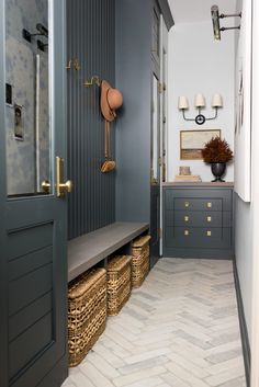 an image of a hallway with gray walls and drawers