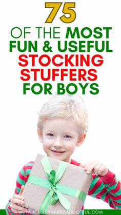 a young boy holding a present box with the words 75 off the most fun and useful stocking stuff for boys