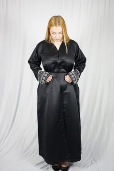 This abaya is sized based off of both height and fitting.