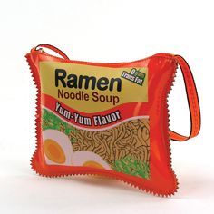 A snack for a snack! A stand out but still practical accessory, this crossbody bag is an attention grabber!•Officially Licensed•Quality vinyl material and uniquely designed•Includes 24" strap drop•Top zippered closure•Fabric lined interior Funky Purses, Sourpuss Clothing, Ramen Noodle Soup, Novelty Purses, Vinyl Bag, Ramen Noodle, Instant Noodle, Peinados Fáciles Para Cabello Corto, Novelty Bags