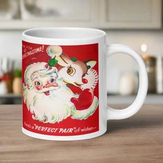 This ceramic glossy coffee mug features a retro vintage Christmas illustration of Santa and Rudolph. It says For You at Christmastime! at the top and Here's a Perfect Pair of wishes... at the bottom. Midcentury Illustration, Santa And Rudolph, Retro Mug, Rudolph Christmas, Marathons, Christmas Movie, Valentines Day Weddings, Vintage Christmas Cards, Halloween Accessories