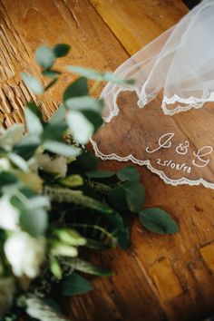 a bride's veil and bouquet on the floor