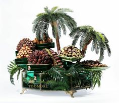 there are many different types of fruits in the basket on this table, including palm trees