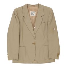 Description:Vintage beige Burberry blazer, fits large.GENDER: womens CONDITION: good - dark mark on front lapels and faint light coloured streak on left sleeve, as well as a dark mark on back. all marks less than 1 cm in size.STYLE: blazerERA: 1990sCOLOUR: beigeFABRIC: cottonNotes: Garment does not have size label however fits a women's large. Pit to pit measurement is 20". Composition is listed as 100% cotton. Beige Single-button Sport Coat For Office, Classic Beige Sport Coat For Office, Beige Sport Coat With Notch Lapel For Office, Beige Notch Lapel Sport Coat For Office, Office Beige Sport Coat With Notch Lapel, Beige Lapel Collar Sport Coat For Office, Vintage Beige Sport Coat For Work, Vintage Beige Sport Coat For Spring, Vintage Cream Blazer For Work