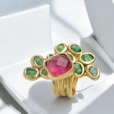 Discover the elegance of our handmade Pink Tourmaline and Rough Tsavorite Gemstone Ring, a true masterpiece crafted with love and attention to detail. This unique artisan ring is set in a stunning blend of silver and gold, making it a perfect statement cocktail ring for any occasion. The vivid pink tourmaline and the earthy rough tsavorite gemstones create a captivating contrast, embodying the essence of luxury gemstone jewelry. Whether you're searching for a custom jewelry design or a meaningfu Fusion Style Emerald Gemstone Ring For Gift, Unique Tourmaline Gemstone Rings, Fusion Style Tourmaline Ring As A Gift, Fusion Style Tourmaline Gift Ring, Fusion Style Tourmaline Ring For Gift, Green Tourmaline Multi-stone Emerald Ring, Tourmaline Emerald Ring With Gemstone Accents As Gift, Ruby Ring With Gemstone Accents For Gift, Fine Jewelry Tourmaline Gemstones