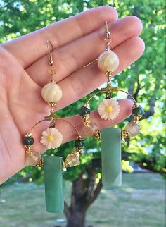 These handmade, natured-inspired, one-of-a-kind earrings are made with white banded agate, green aventurine, volcano quartz, natural jasper, plastic flower charms, and 18k gold-plated, nickel-free brass. ❁ Receive a FREE surprise pair of earrings with your purchase! This pair is selected especially for you, based on your order :) ❁ This design, like every other listing in my shop, is meticulously crafted with attention to color, shape, and movement. It is made slowly with patience and joy, and Handmade Whimsical Dangle Flower Earrings, Funky Cottagecore, Whimsical Flower-shaped Handmade Earrings, Green Whimsical Flower Shaped Earrings, Volcano Quartz, Whimsical Multicolor Dangle Flower Earrings, Green Flower-shaped Jewelry With Dangling Beads, Botanical Fashion, Long Stem Flowers