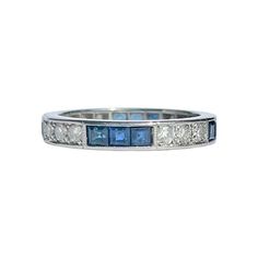 This sweet diamond and blue sapphire eternity has the stones set within the band. The stones are grouped in collections of three diamonds and three sapphires. The diamonds measure approx 3pts each and the sapphires measure approx 10pts each. Ring Size: N or 6 3/4 Band Width: 3mm Weight: 4g Blue Sapphire Ring With Single Cut Diamonds In Platinum, Platinum Blue Diamond Ring With Single Cut Diamonds, Classic Blue Diamond Ring With Single Cut, Blue Diamond Stackable Eternity Band, Classic Blue Eternity Band For Anniversary, Classic Sapphire Stackable Diamond Ring, Classic Diamond Eternity Band With Gemstones, Timeless Blue Multi-stone Sapphire Ring, Classic Stackable Sapphire Ring With Diamonds