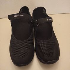 Black Mesh Upper. Adjustable Strap For Perfect Fit. Non Skid Soles. Size 8.5 Casual Black Non-slip Walking Shoes, Black Non-slip Lace-up Walking Shoes, Comfortable Black Walking Shoes With Round Toe, Black Flat Heel Walking Shoes For Sports, Black Non-slip Flat Walking Shoes, Black Non-slip Walking Shoes With Flat Heel, Black Non-slip Sneakers With Comfortable Fit, Comfortable Black Walking Shoes With Rubber Sole, Comfortable Black Walking Shoes With Flat Heel