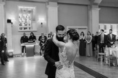 a bride and groom sharing their first dance