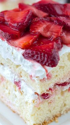 a piece of cake with strawberries on top