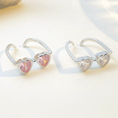 Description:Heart Sunglasses Crystal Love RingSpecifications:Material: rhinestone, copper, silverCrystal Colors: Pink/ClearSize: #7 adjustableWeight: 2.3 g/pc Love is in the air with our Heart Sunglasses Crystal Love Ring! This playful accessory adds a touch of whimsy to any outfit. With its heart shaped lenses and sparkling crystals, you'll be sure to spread smiles wherever you go. Perfect for those who like to stand out and have fun! Jóias Body Chains, Heart Shape Sunglasses, Gifts Couple, Heart Shaped Glasses, Heart Glasses, Heart Shaped Sunglasses, Couple Items, Heart Sunglasses, Enamel Bracelet