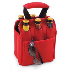 a red bag with six bottles in it and sunglasses on the bottom, sitting next to each other