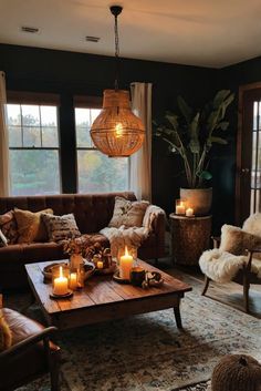 a living room filled with lots of furniture and candles on top of a coffee table