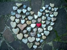 heart made out of rocks on the ground