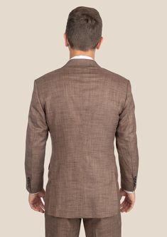 Be the best dressed at your next event with the Tawny Brown Hopsack Suit. This cool and stylish suit exudes elegance and luxury. Custom made from a luxurious bamboo/wool/linen/silk blend from Cavani, you're guaranteed to look as good as you feel. Dress to impress with this must-have suit. Luxury Fitted Linen Tweed Jacket, Fitted Linen Suit With Pressed Crease, Fitted Linen Suits With Pressed Crease, Elegant Fitted Linen Sport Coat, Fitted Linen Suit With Welt Pockets, Fitted Linen Suits With Welt Pockets, Luxury Linen Tweed Jacket With Notch Lapel, Luxury Linen Tweed Jacket For Business, Fitted Linen Suits For Work