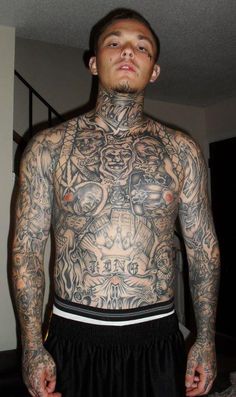 a man with lots of tattoos on his chest