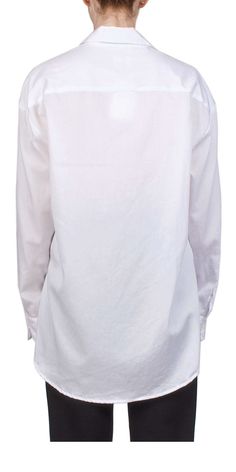 Upgrade your wardrobe with the Yoko Oversized Button Down II by LESET. Made with crisp cotton, this update to their bestselling button down offers an oversized silhouette, drop shoulders, and a longer length for ultimate comfort and style. Perfect for any occasion. Details: Color: White 100% cotton Made in Los Angeles, CA Length: 30'' Vendor Code: LT230A-YOKO Dropped shoulders, oversized silhouette One size fits most Model is 5ft 5in and is wearing size OS Oversized Button-up Shirt For Daywear, Oversized Blouse With Button Closure For Daywear, Oversized Cotton Blouse With Buttons, Oversized Everyday Shirt With Placket, Oversized Cotton Blouse With Placket, Elevated Basics, Oversized Silhouette, Long Length, Matching Sets