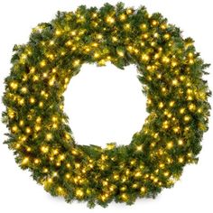 a christmas wreath with yellow lights on it and green branches in the center, isolated against a white background