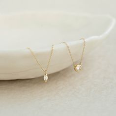 Featuring a marquise diamond drop on a 14k yellow gold chain, the Aletta Necklace is an elegant and understated piece for any occasion.


Lab grown marquise diamond size: 2.2mm x 4.2mm

Total carat weight: 0.08 

14k yellow gold  

Necklace can be worn at 16”, 17”, and 18” Gold Marquise Solitaire Necklace, Gold Marquise Solitaire Necklace For Formal Occasions, Formal Gold Marquise Solitaire Necklace, Gold Marquise Solitaire Necklace Gift, Gold Necklace With Single Marquise Cut Diamond, Gold Marquise Cut Necklace With Single Diamond, Gold Necklace With Marquise Cut Diamond, Dainty Marquise Yellow Gold Diamond Necklace, Gold Marquise Cut Diamond Necklace