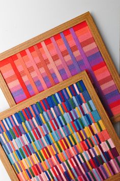 two pieces of art made out of colored strips