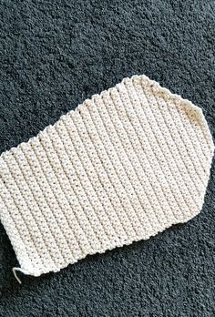 a crocheted dishcloth laying on the floor