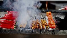 the food is being cooked on the grill