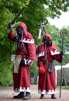 two people dressed in red and white holding swords