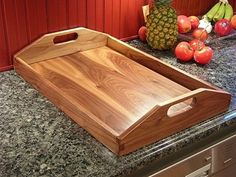 a wooden cutting board sitting on top of a counter